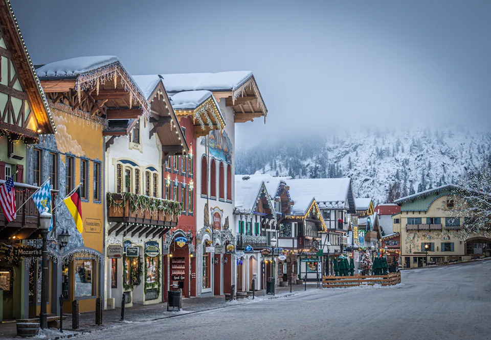 Snow-covered Bavarian-style buildings line the main street of Leavenworth, Washington, during the town’s Christmas Village holiday season.