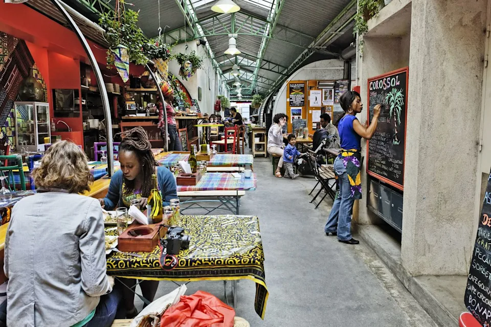 Bruno de Hogues/Gamma-Rapho via Getty Images An African restaurant in Marché des Enfants Rouges.