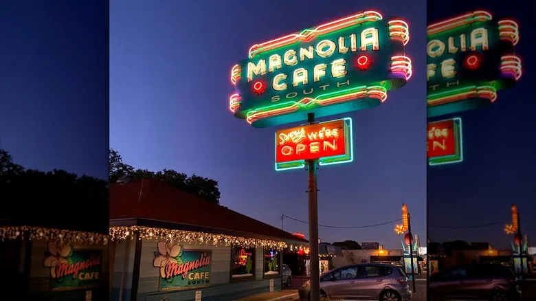 Exterior of Magnolia Cafe, including sign, at night