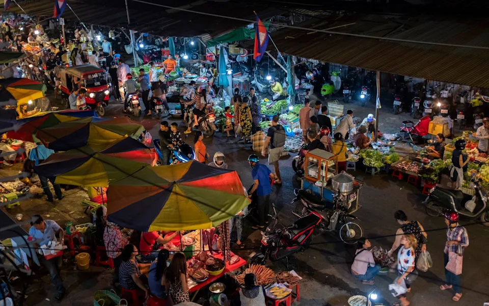 A group of people at Phnom Penh night market