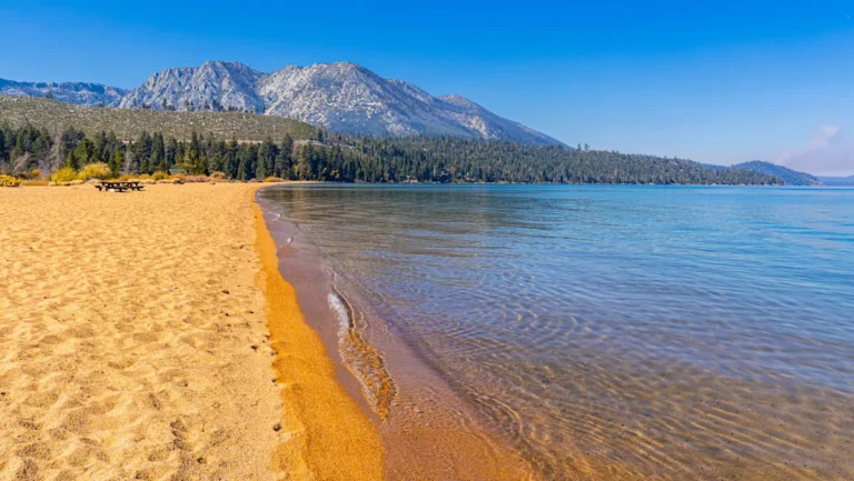 A Stunning Beach On The Shores Of Lake Tahoe Boasts Panoramic Sierra Nevada Mountain Views