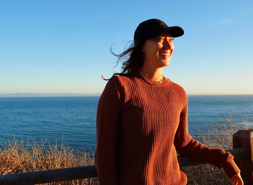 The writer posing near a beach in San Diego.