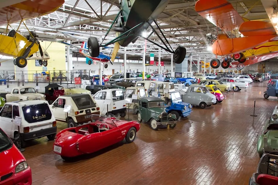 Vintage cars and planes on an exhibit floor at the Lane Motor Museum in Nashville, Tennessee.
