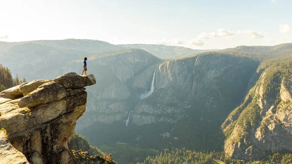 Hiker at the Glacier Point with View to Yosemite Falls and Valley in the Yosemite National Park, California, USA