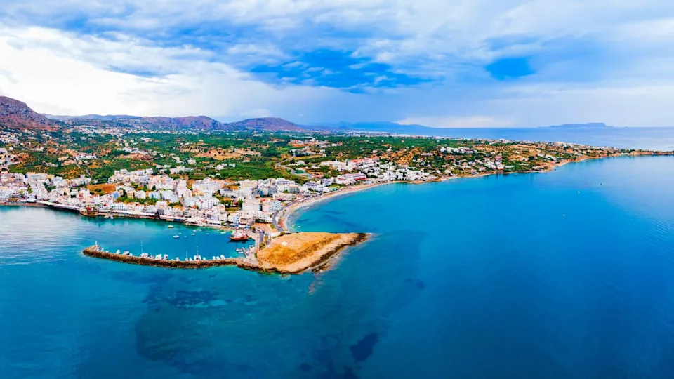 Hersonissos harbor aerial panoramic view. Hersonissos or Chersonissos is a town in the north of Crete island in Greece.