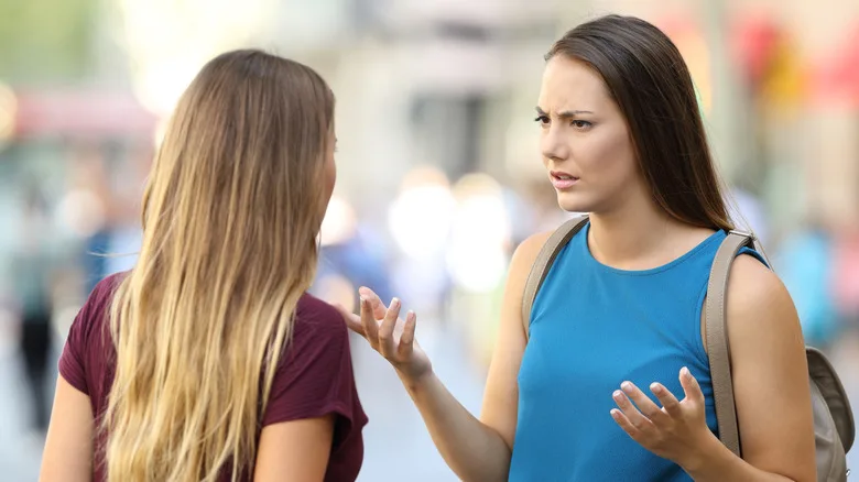 Two women talking on the street