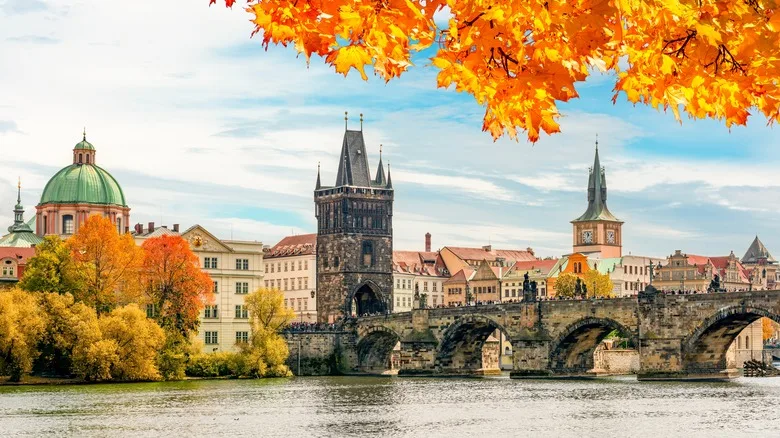 Prague cityscape with Charles bridge over Vltava river in autumn, Czech Republic