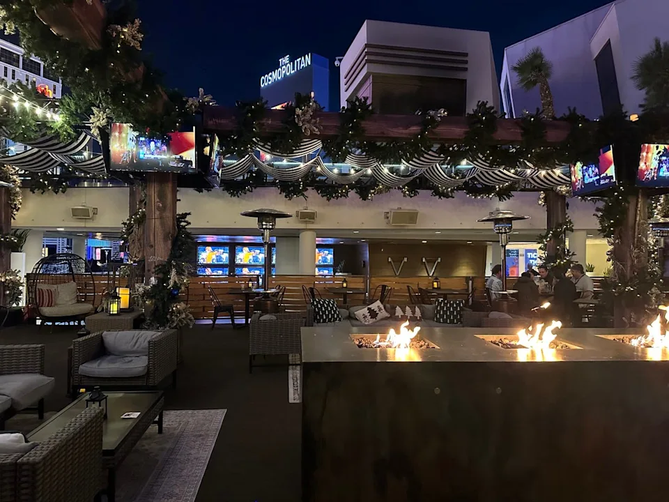 Fire pits and bar area at rooftop skating rink at Cosmopolitan Veg