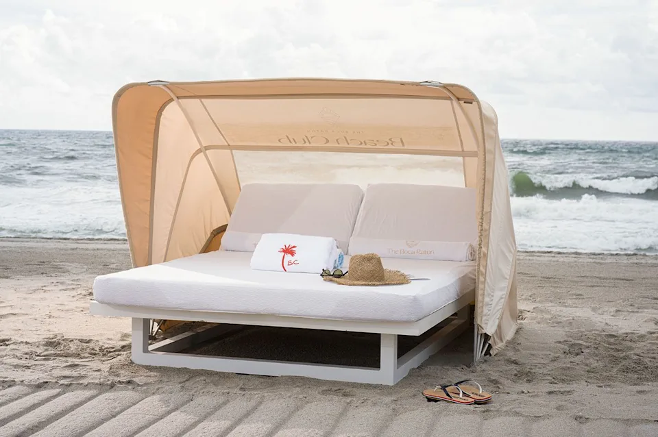 Mark Mediana/The Boca Raton Guests can relax on a beach front day bed.