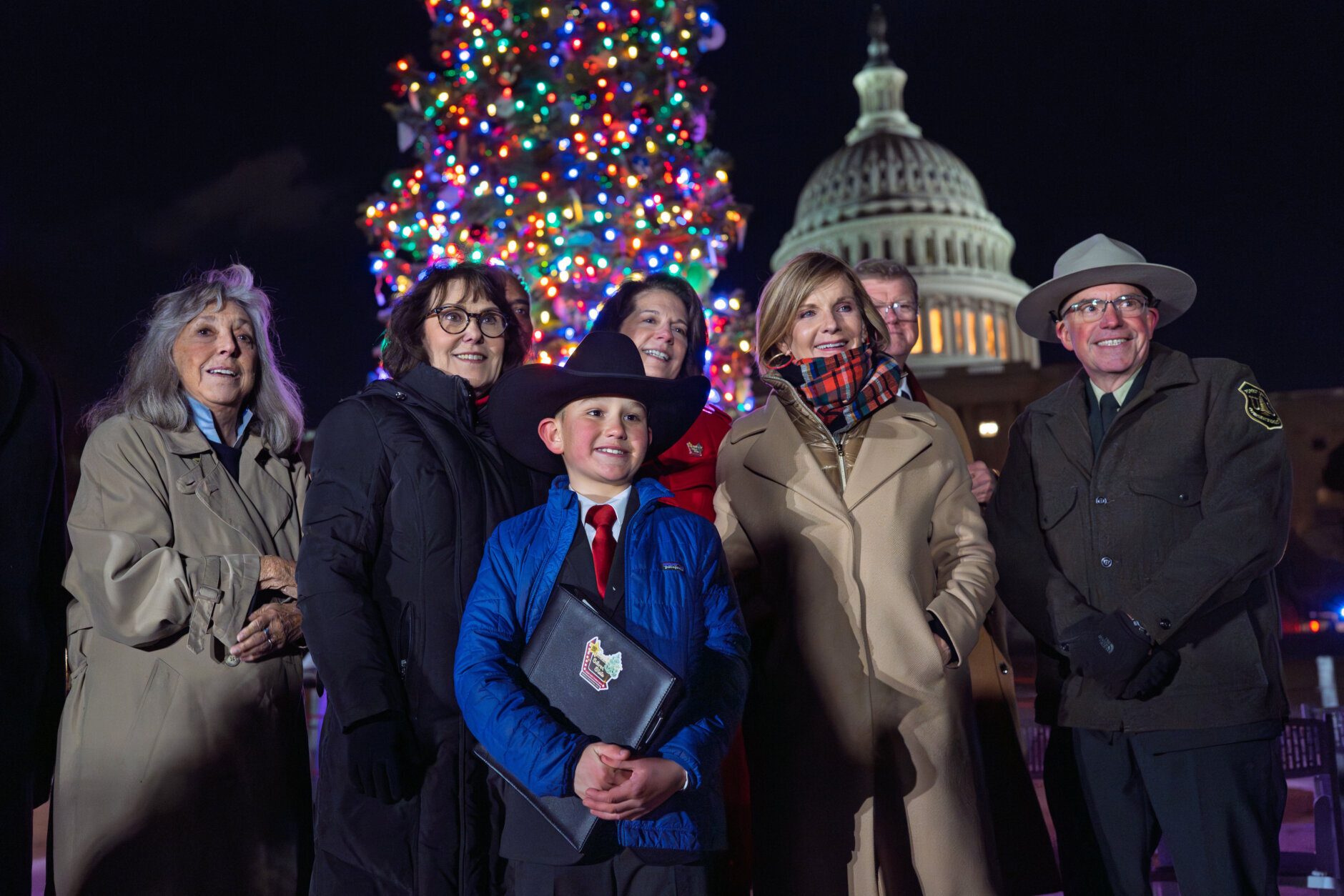 Grady Armstrong, a fourth-grade student from Virginia City, Nev., stands with members of the Nevada Congressional Delegation during the lighting of the U.S. Capitol Christmas tree, a 53-foot red fir from the Humboldt-Toiyabe National Forest in Nevada, in Washington, Tuesday, Dec. 2, 2025. (AP Photo/J. Scott Applewhite)