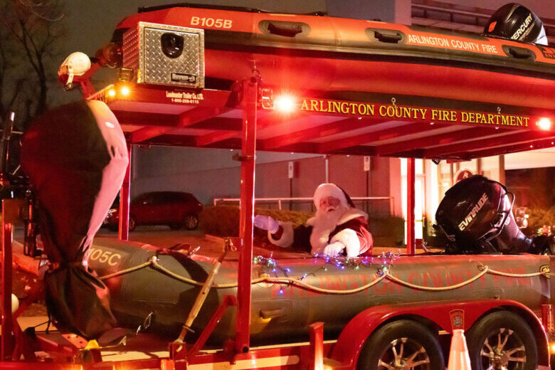 santa riding on fire truck