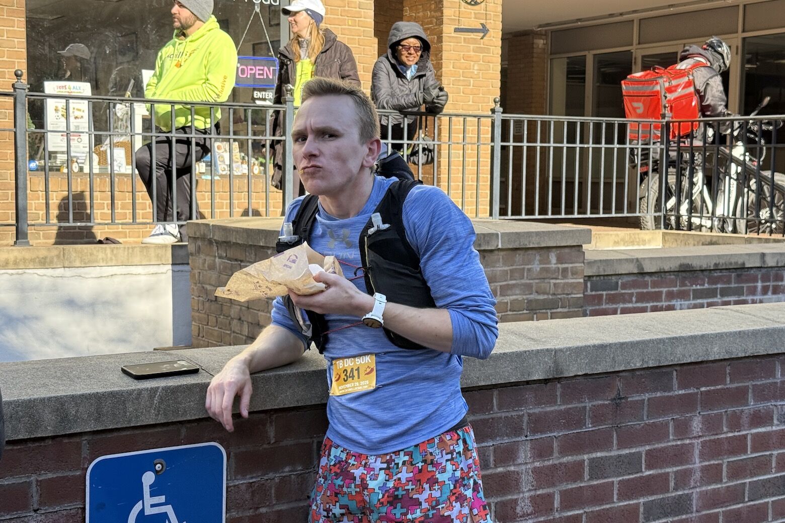 Man runs while eating tacos