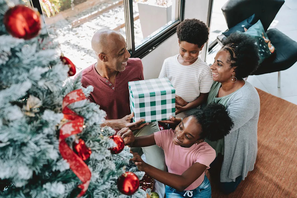 Family gathered at the Christmas tree