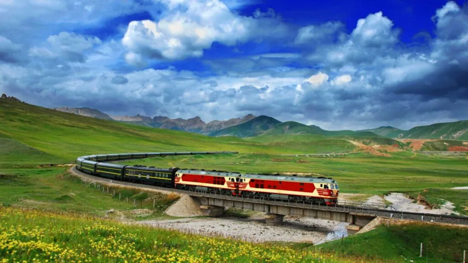 Passenger train travels on the Qingzang (Qinghai-Tibet) Railway in Tianjun county, Haixi Mongol and Tibetan Autonomous Prefecture, northwest China's Qinghai province, 11 August 2010