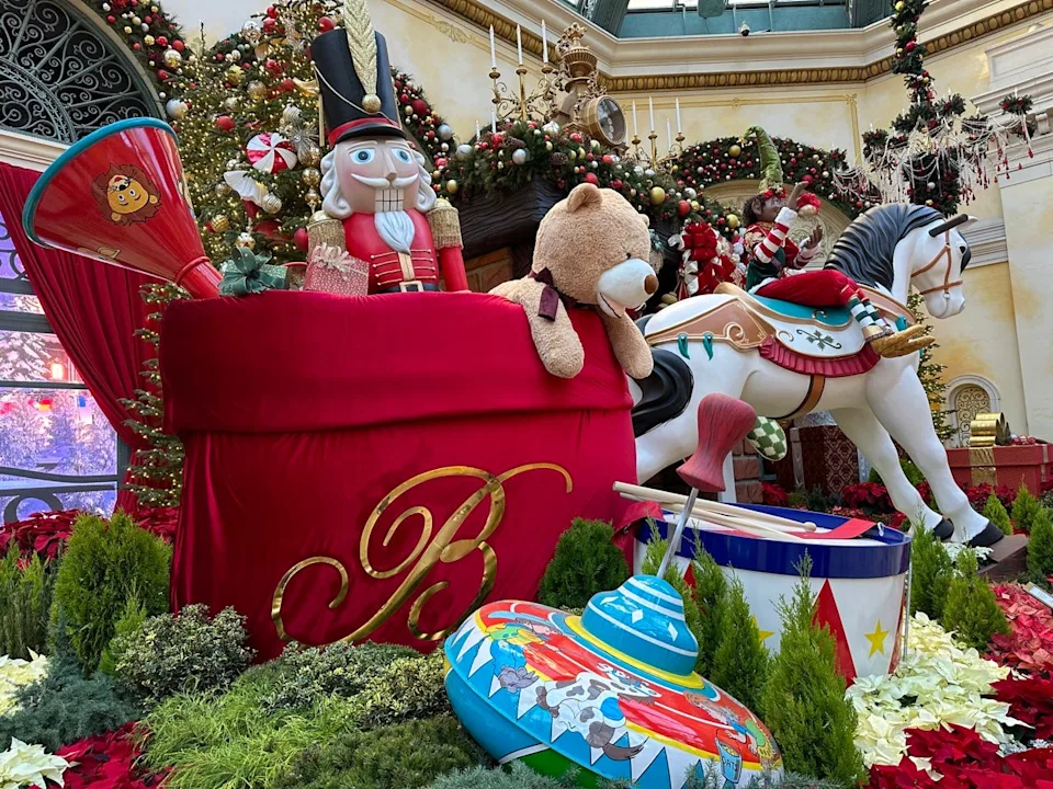 Large fake toy display at Bellagio with toy bag with nutcracker, stuffed bear, spinning top