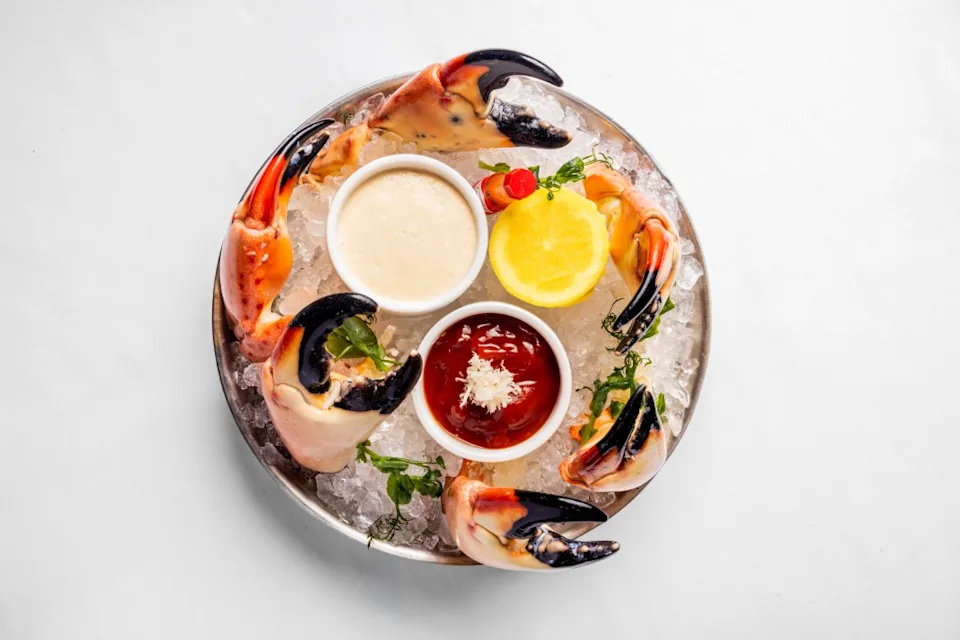 A tray of Alaskan king crab claws on a bed of ice. Courtesy of The Louis Collection