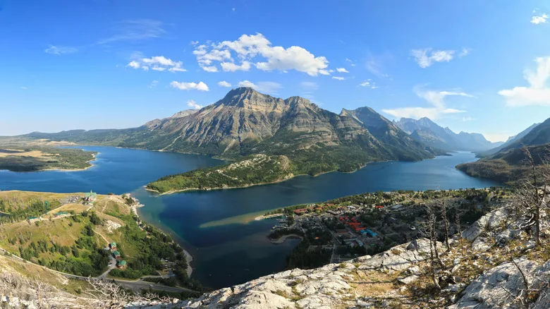 Two lakes in a mountain valley with a small village on the shore