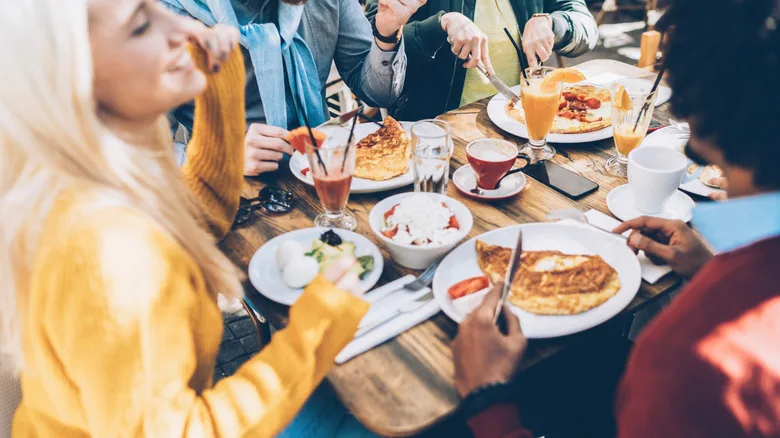 Friends at a table eating brunch together