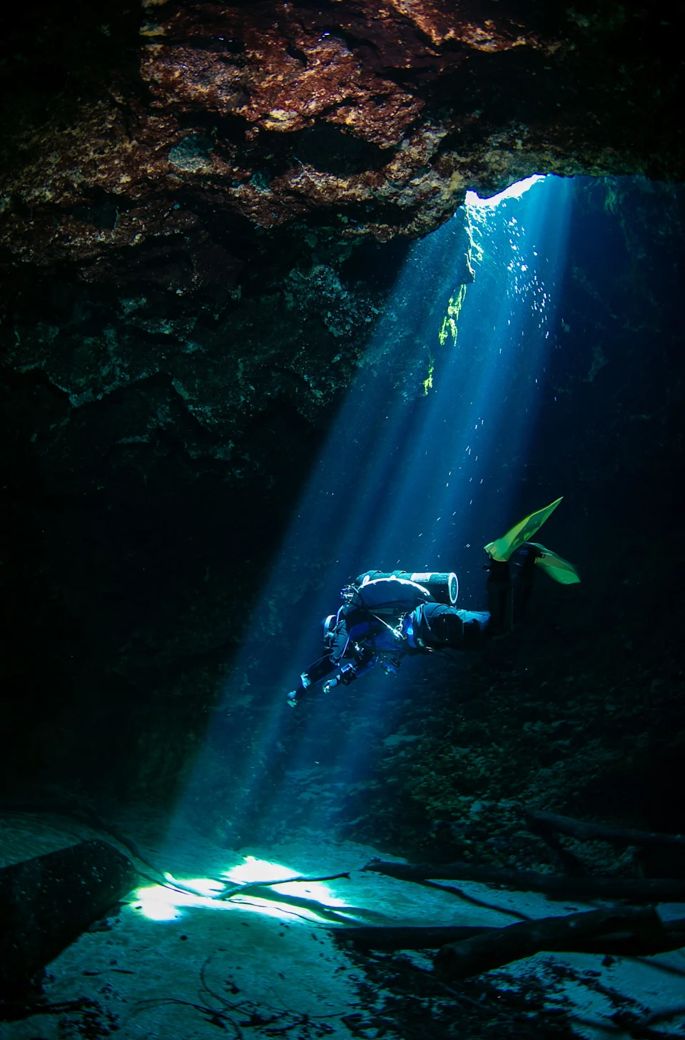 Taylor Schott descends in the beam of light at Blue Hole at Ichetucknee Springs State Park on Oct. 22 in Fort White. Blue Hole offers a lovely swim and exciting dive for those with the right training.