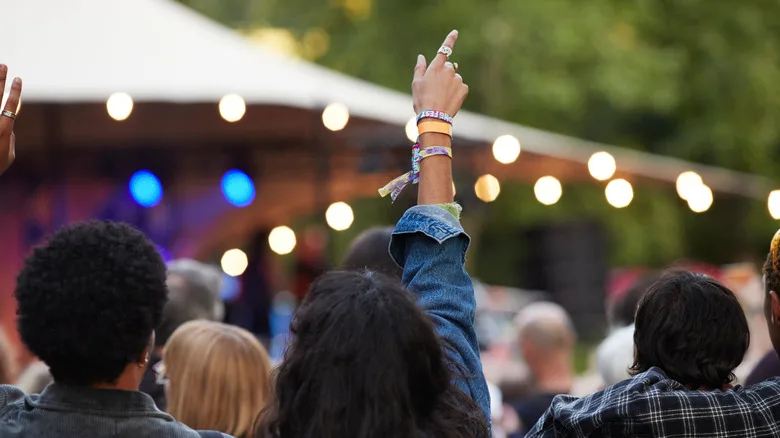 People watching live music at an outside venue