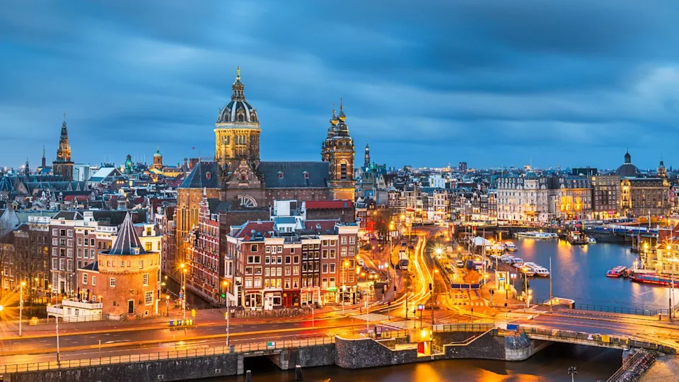 Amsterdam, Netherlands town cityscape over the Old Centre District with Basilica of Saint Nicholas.