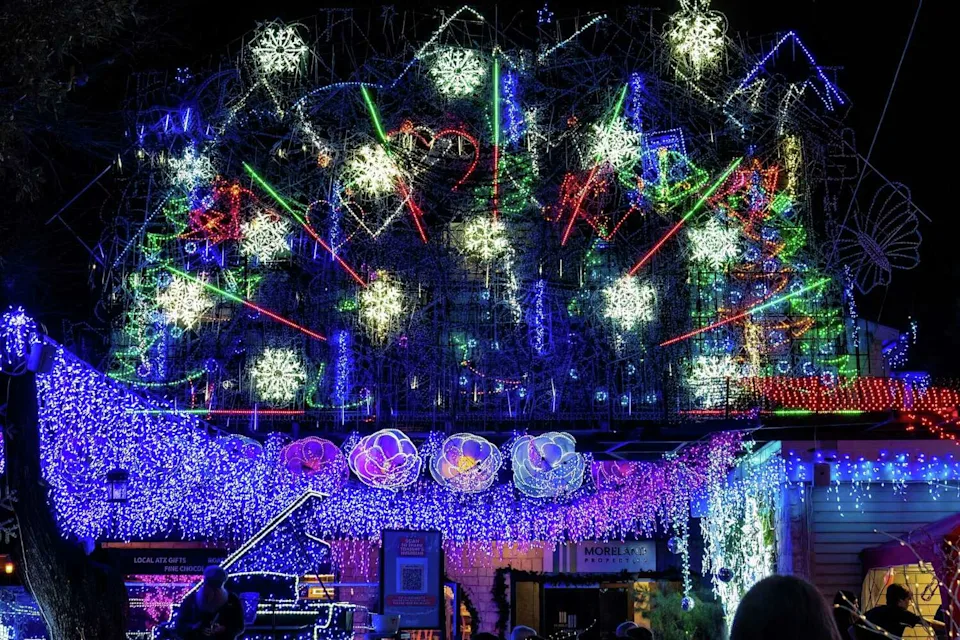 Holiday décor and lights are an annual tradition at Mozart's Coffee Roasters on Lake Austin. Customers gather under the lights on Dec. 12, 2022, in Austin, Texas. (Suzanne Cordeiro / Special to American-Statesman)