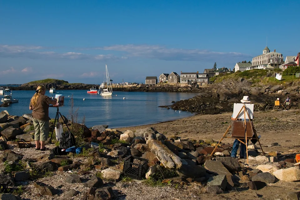 Artists painting scenic landscapes on Monhegan Island.