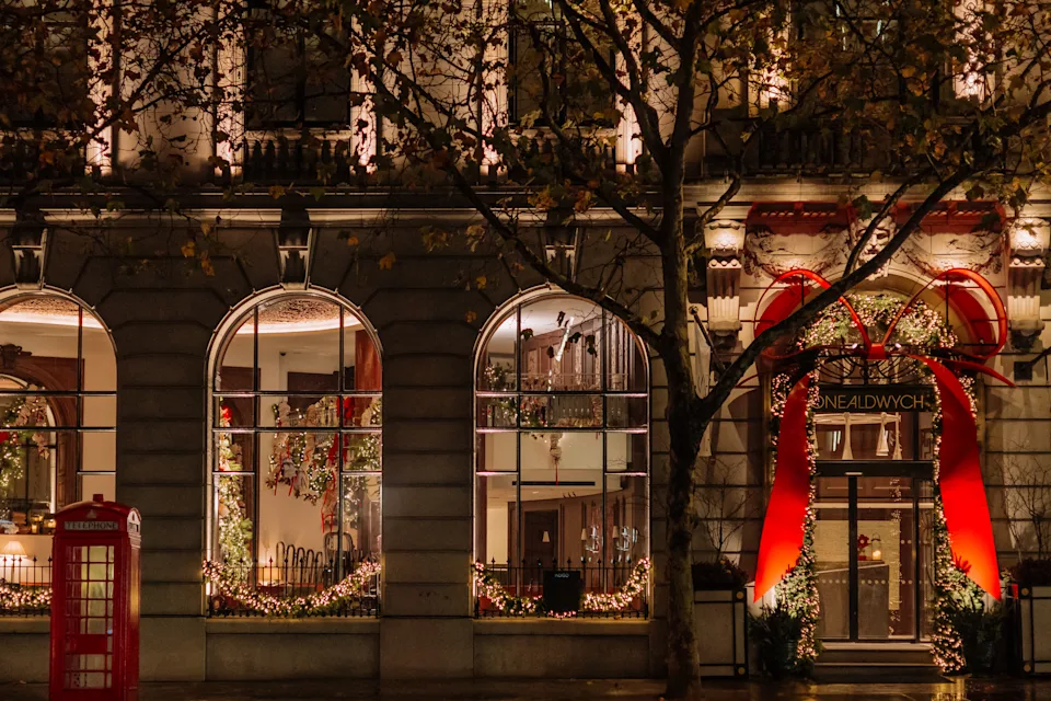 A giant red bow outside of One Aldwych in London