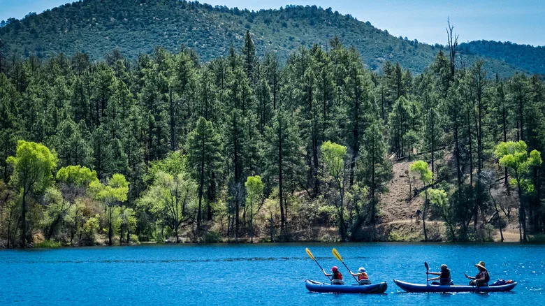 People paddling canoes on Lynx Lake in Arizona
