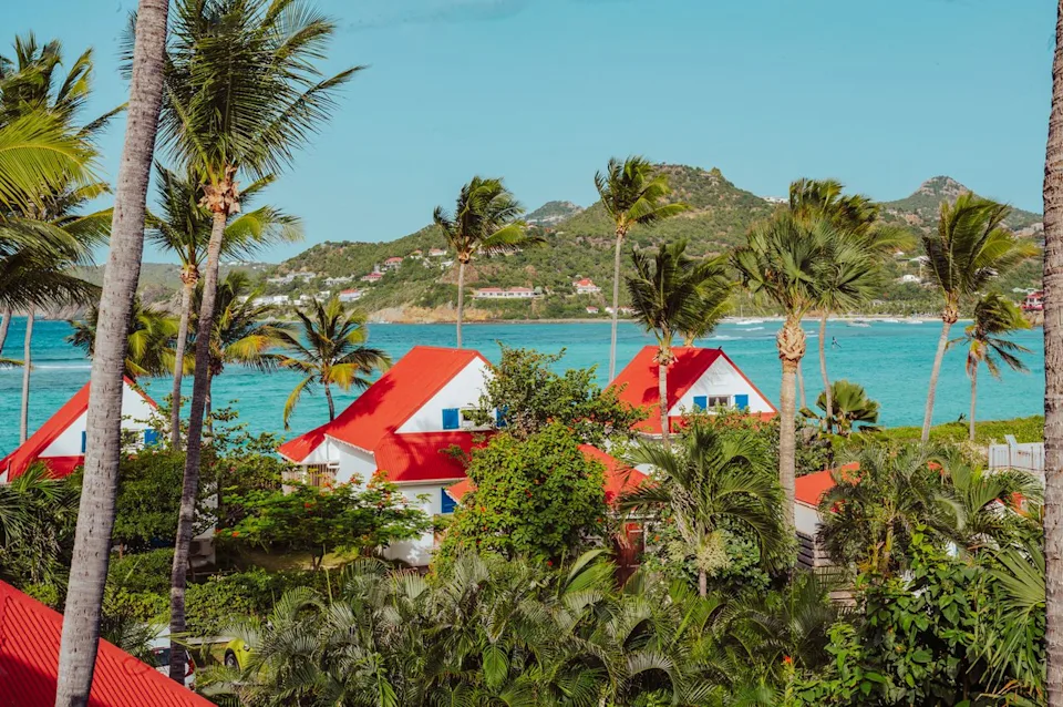 Taylor McIntyre/Travel + Leisure Colorful homes along the turquoise waters of St. Barts.