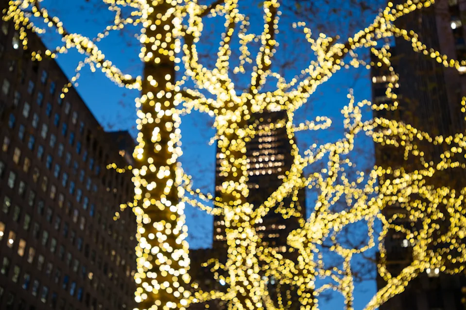 Blurred Christmas Lights on Trees Along a Street in New York City