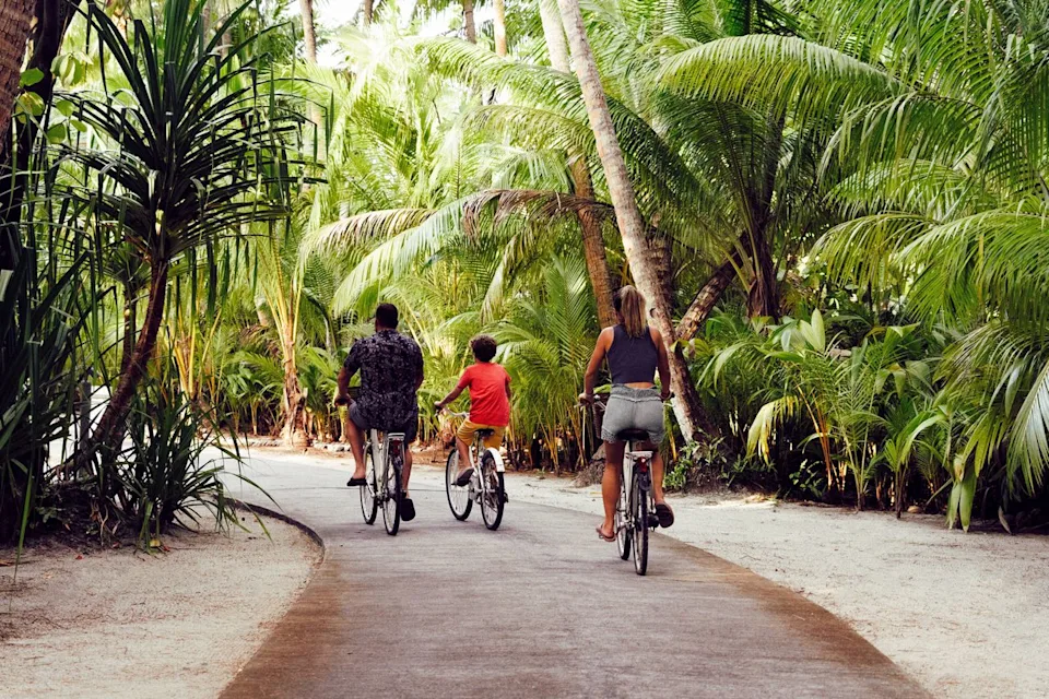 The Brando Guests biking at The Brando, French Polynesia.