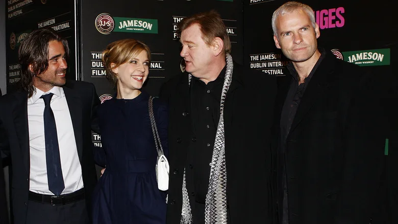 The stars of "In Bruges" pose for a photo with director Martin McDonagh