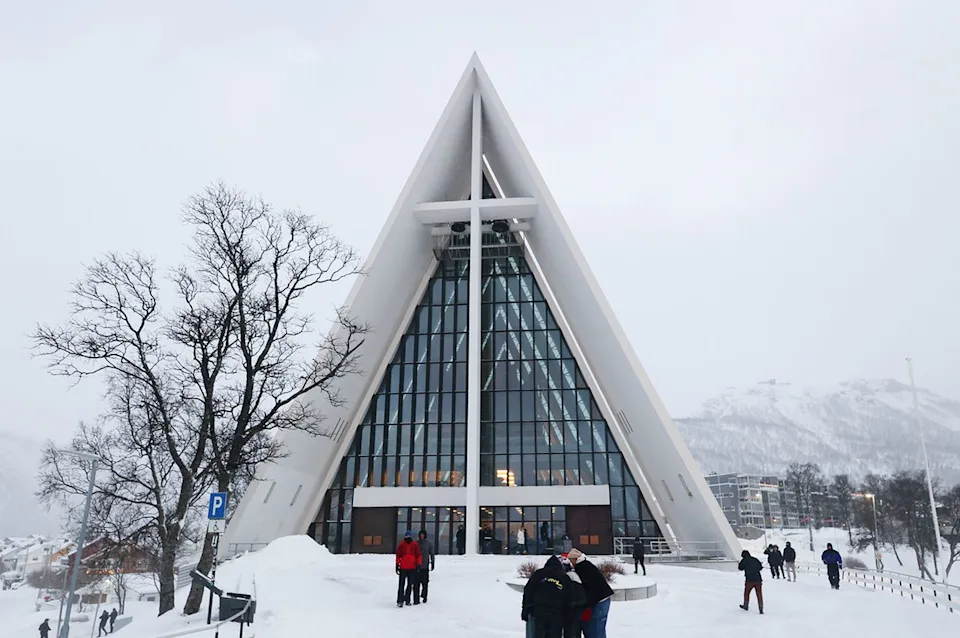 Jakub Porzycki/Getty Images Visitors outside of the Arctic Cathedral in Tromsø.