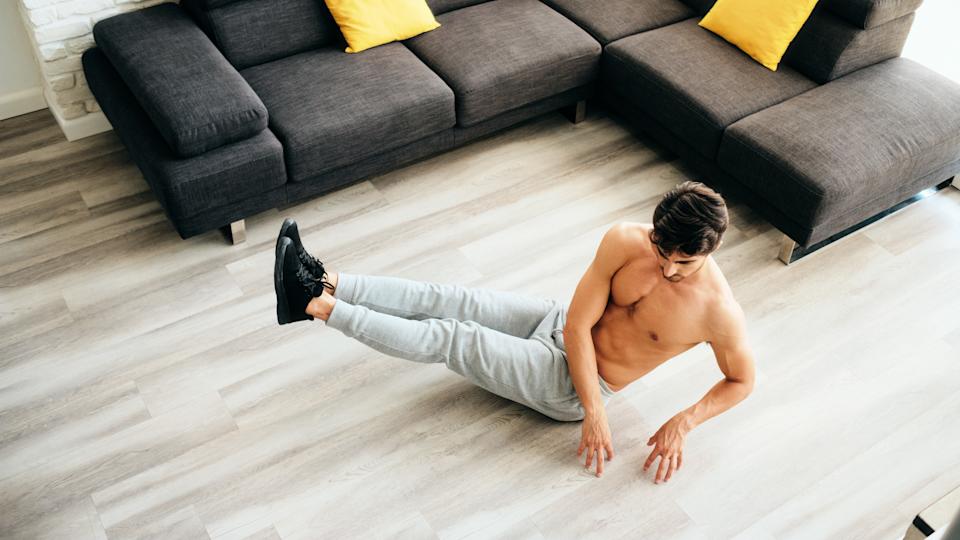 a photo of a man doing the oblique twist exercise