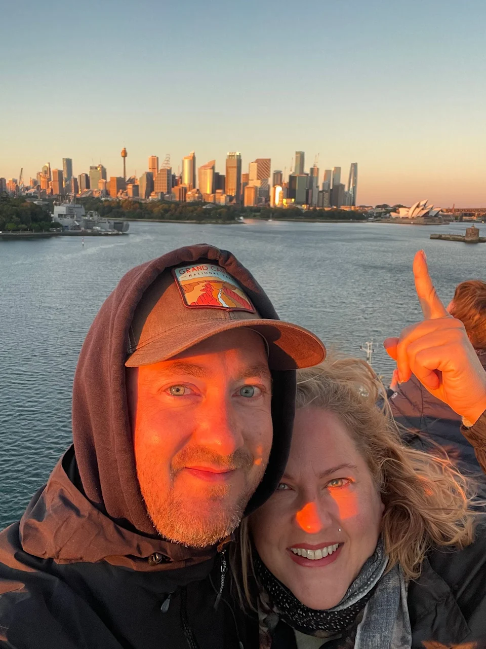 Couple in a sunset with Sydney Opera House in the background.