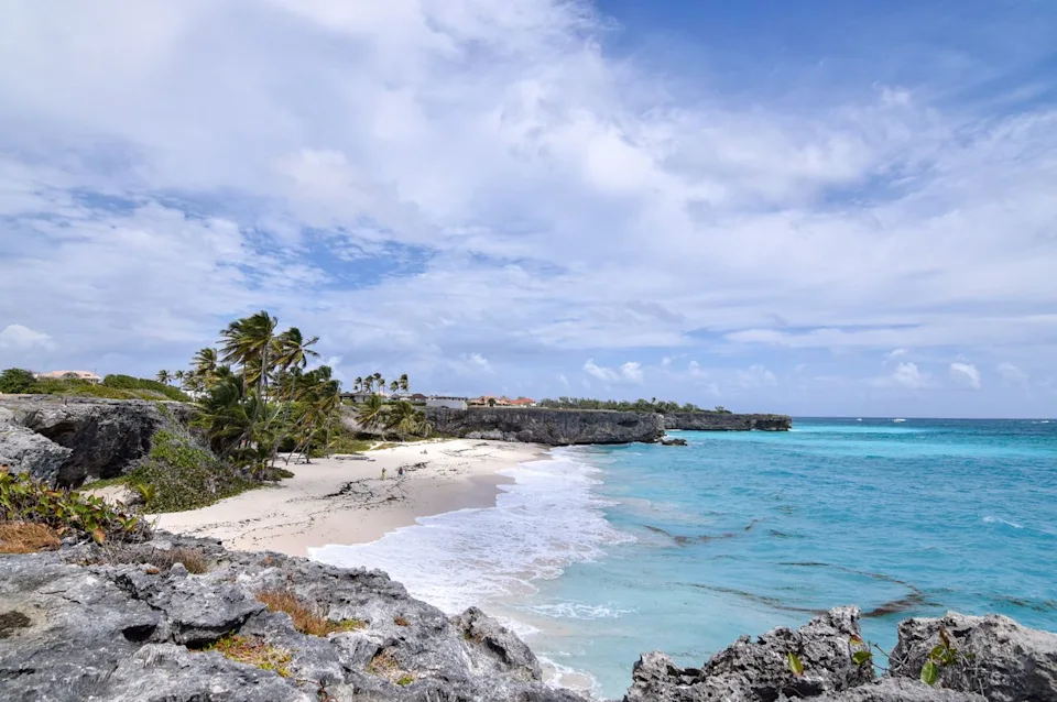 Lauren Breedlove/Travel + Leisure A white sandy beach in Barbados.
