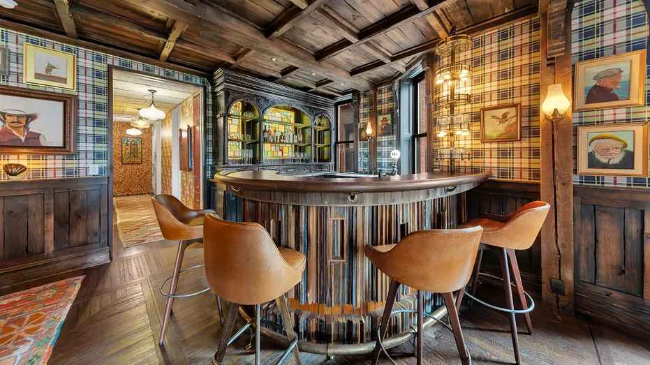 The great room also features a vintage bar with stained glass designs.