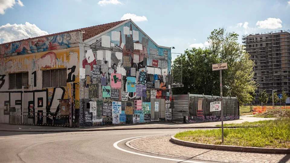 Bologna, Italy 1 January 2025: Vibrant street art and graffiti decorate a building in bologna, italy, adding a splash of color to the urban landscape