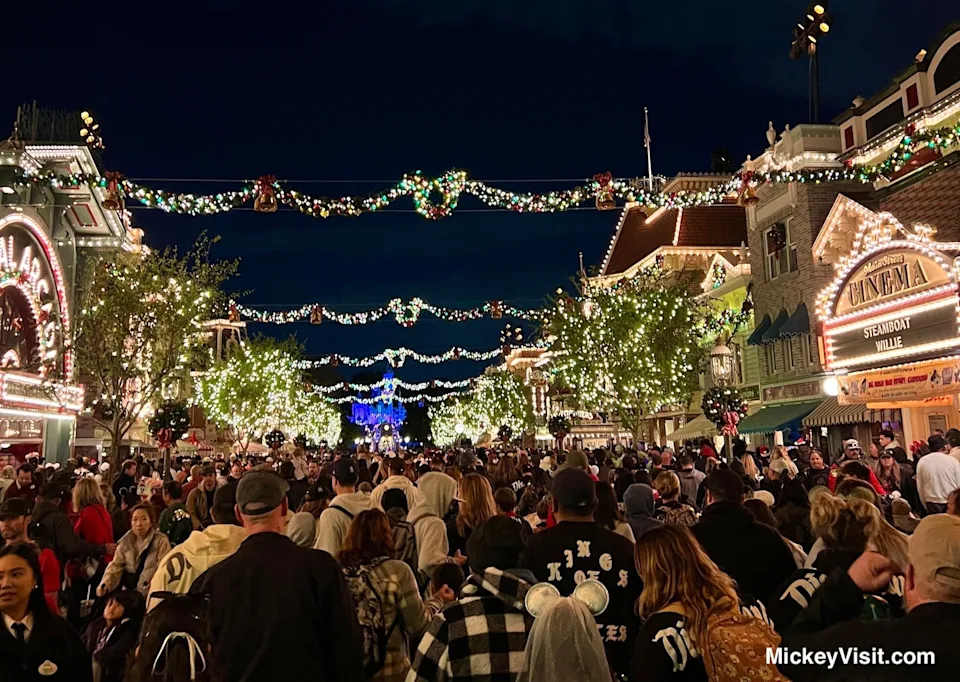 Disneyland holiday crowds Main Street nighttime