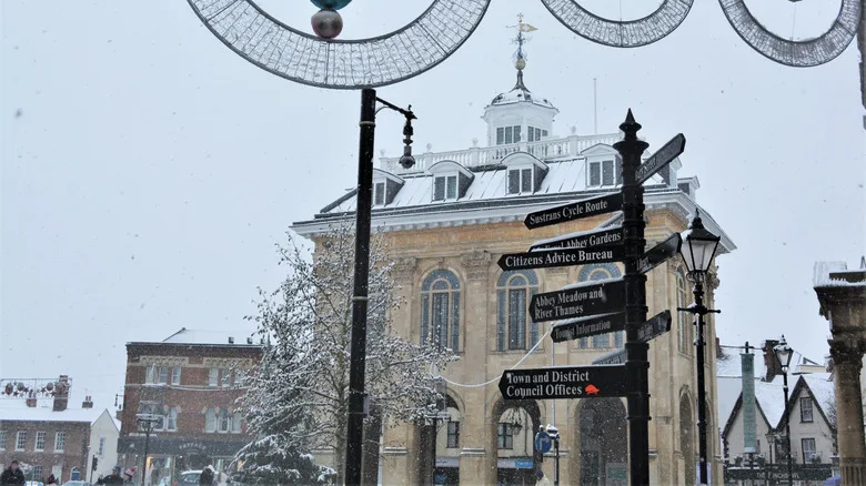 Historic buildings, signs and Christmas decorations covered in snow in Abingdon, Virginia