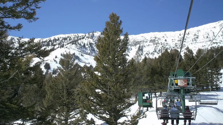 People riding the ski lift at the snowy Bridger Bowl in Montana