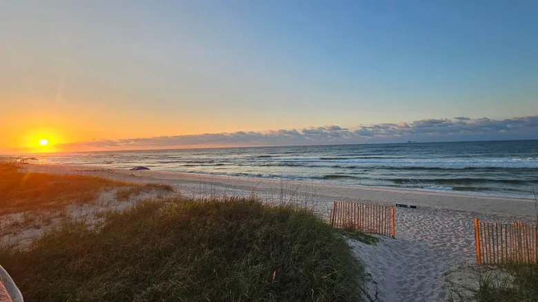 Sunrise at the beach in Fort Morgan at the end of Mobile Point on the Gulf Coast of Alabama