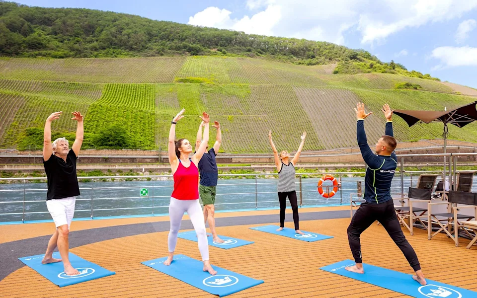AmaCerto yoga on sundeck ; AmaWaterways guide