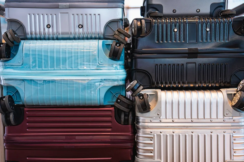 Stacked hard-shell suitcases showcase variety in travel luggage options