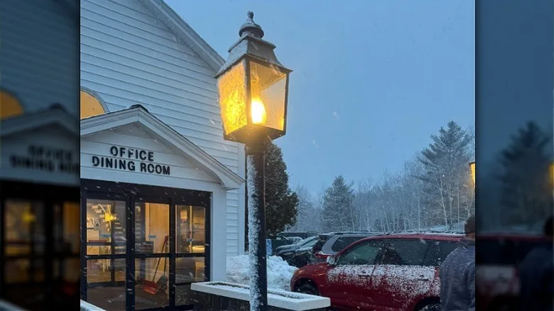 Lightpost with snow outside of the Town & Country Inn and Resort in Shelburne, NH.