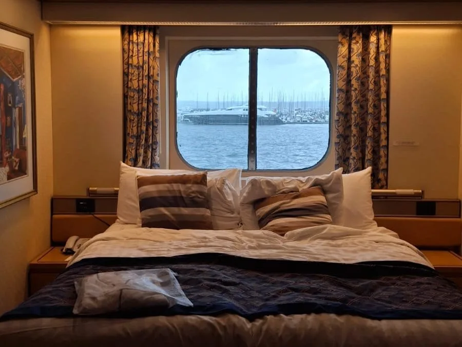 Basc cabin with window, showing bed, on Nomad Cruise.