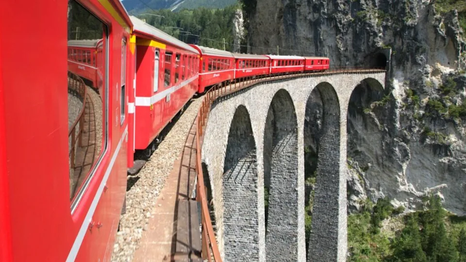 The train of Bernina Express on the Swiss alps