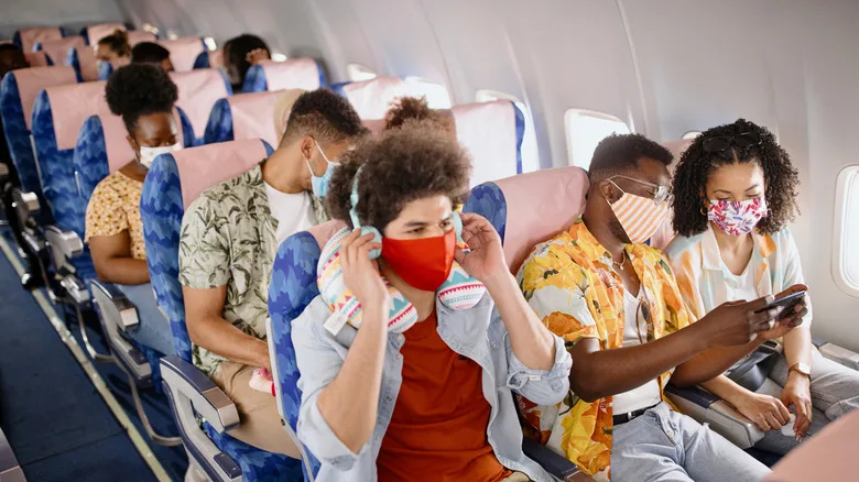 Passengers wearing masks on fiight