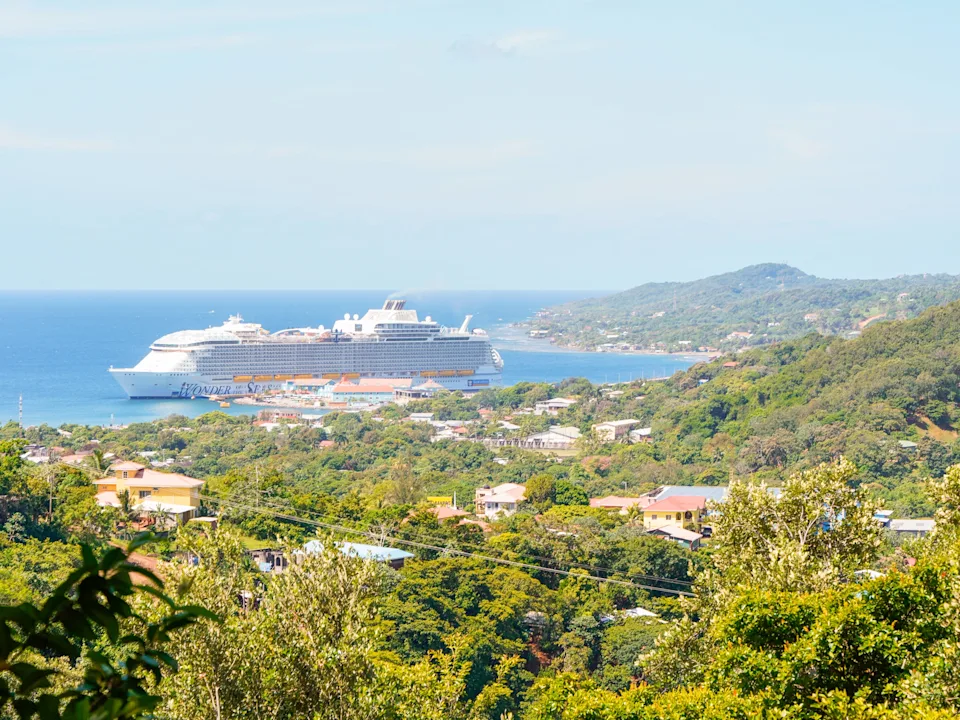 The largest cruise ship in the world, wonder of the seas, is seen docked in Roatan Honduras